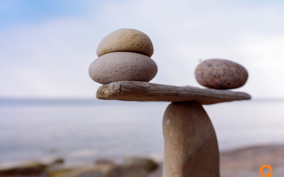 Photo of cairns reflecting balance