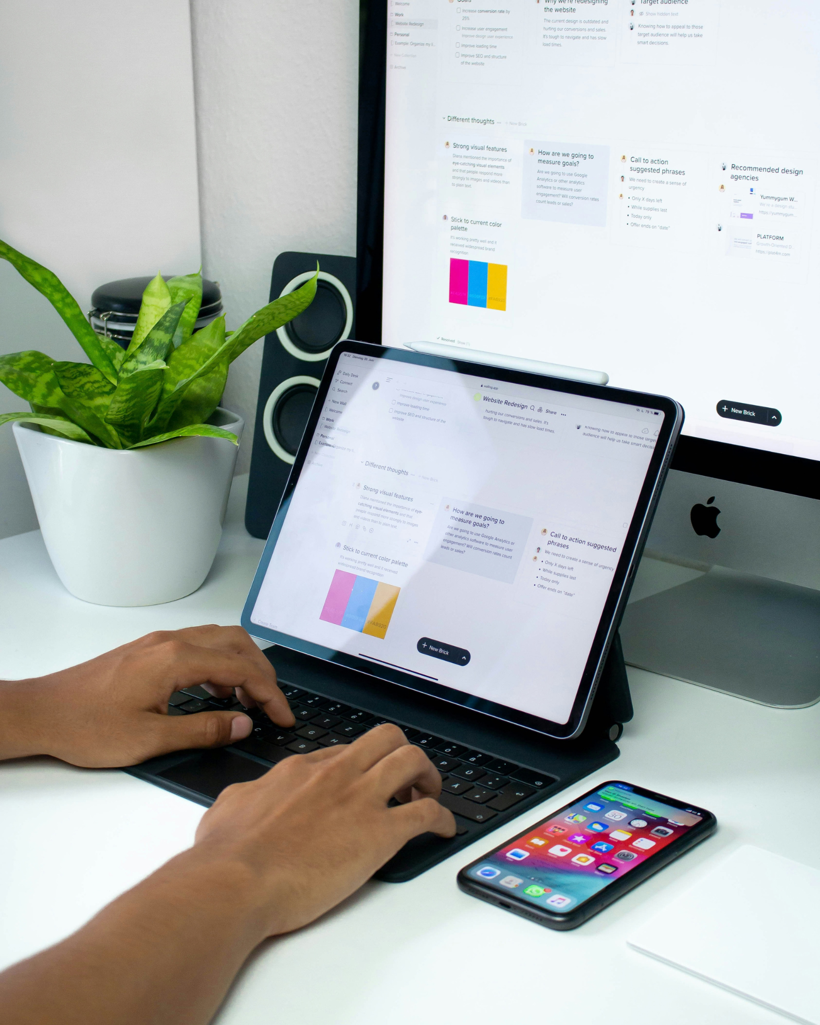 Person planning a website redesign project on a tablet