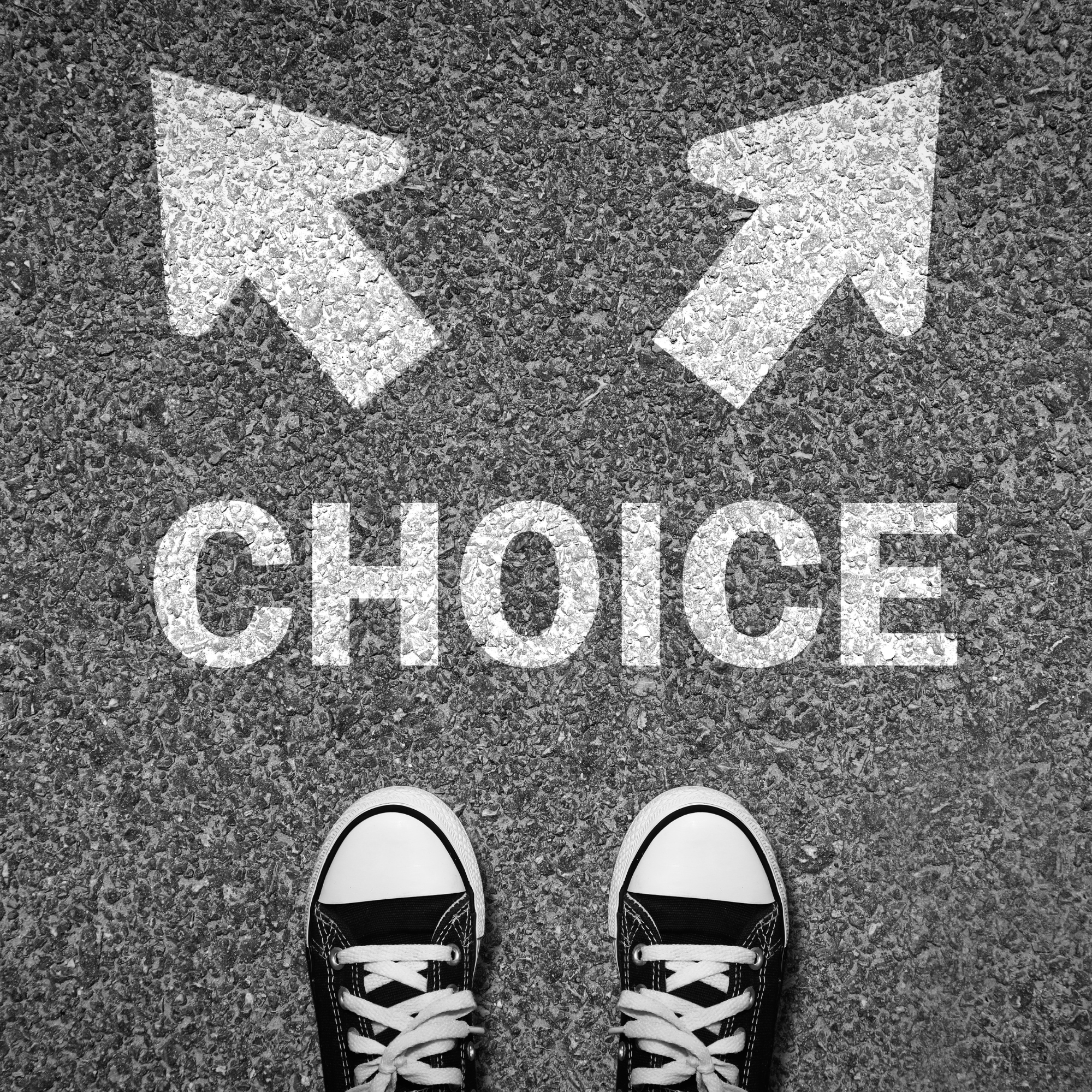 Person facing a choice between two paths