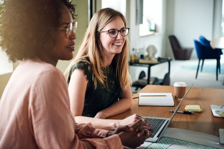 Nonprofit manager reviewing how to track staff time across multiple grants